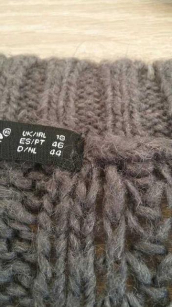 Graue Strickweste kurzärmlig