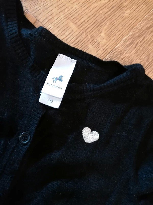 schwarze Weste Gr. 116 mit Volant Palomino