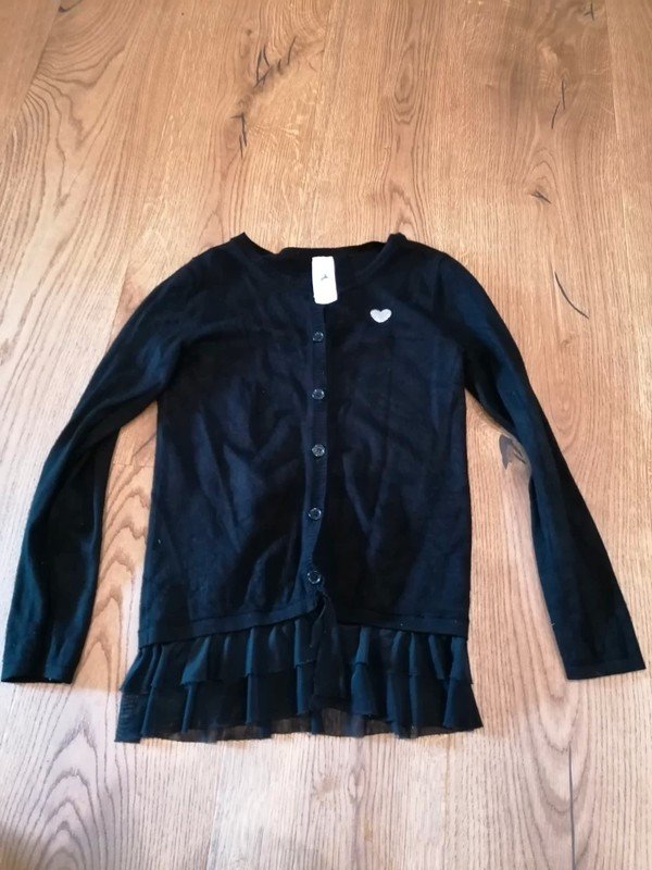 schwarze Weste Gr. 116 mit Volant Palomino