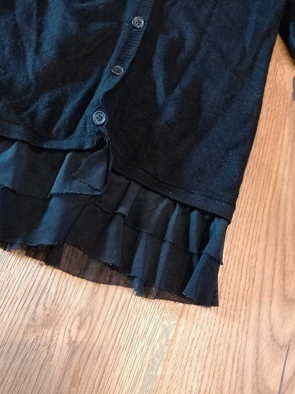 schwarze Weste Gr. 116 mit Volant Palomino