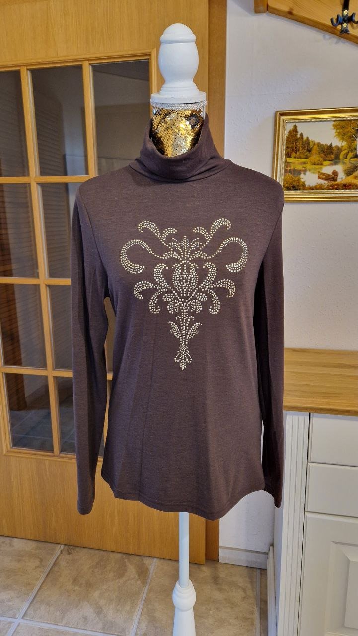 Wie neu. Schöner Rollkragenpullover mit Pailletten.  Große M.