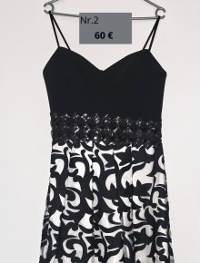 Elegantes schwarz-weiß Kleid mit Pailletten, ideal für festliche Anlässe