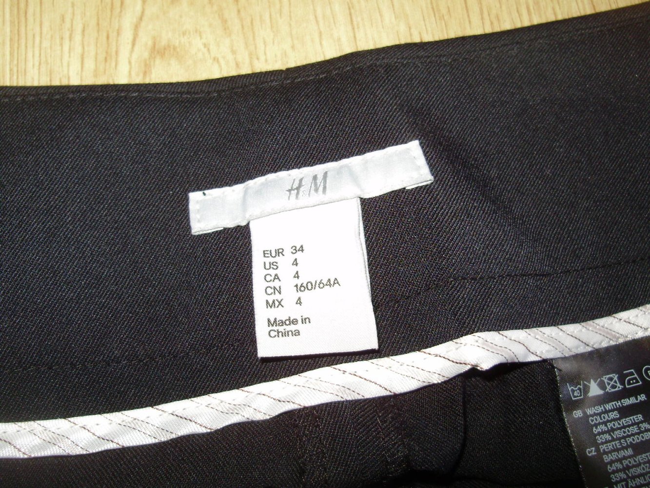 H&M Hose weit schwarz edel business interessanter Bund 34 S