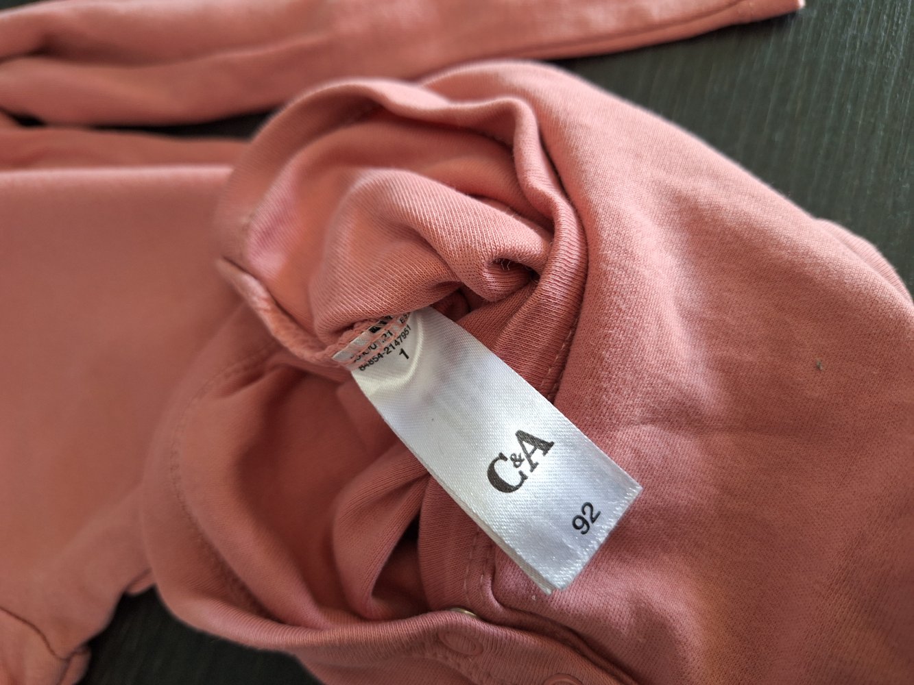 lachsfarbener Langarmbody Gr. 92