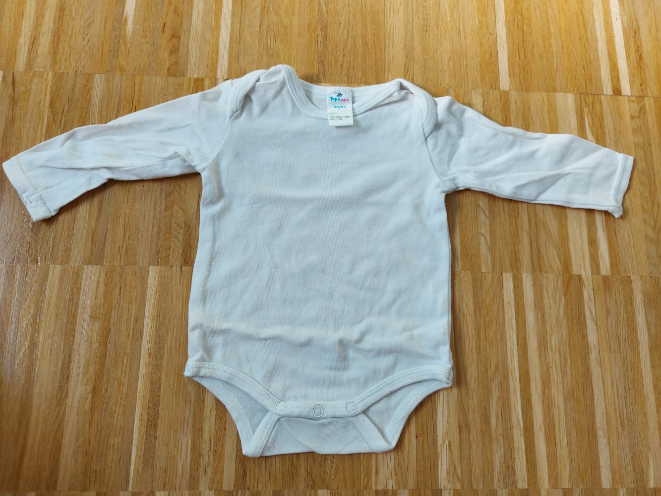weißer Langarmbody Gr. 50/56